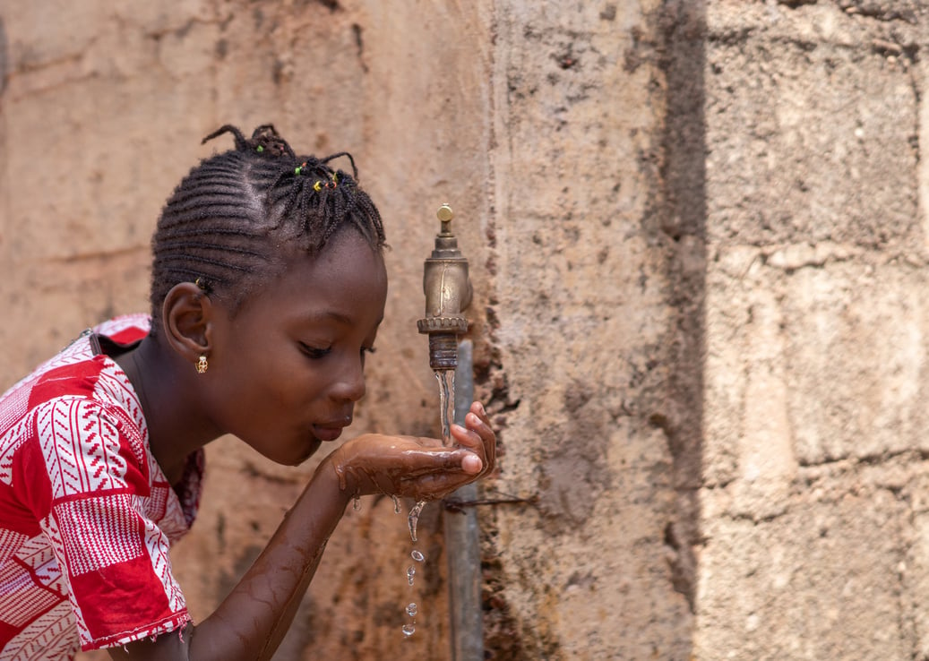 Access to Water is a Human Right, cute African drinking freshwater